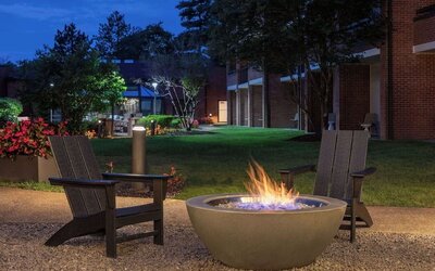 Outdoor seating and fire pit at Sonesta Select Boston Foxborough Mansfield.