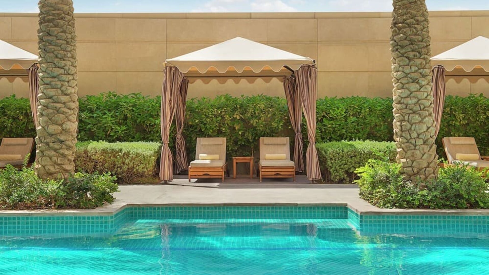 Pool cabanas at Hilton Dubai Al Habtoor City.