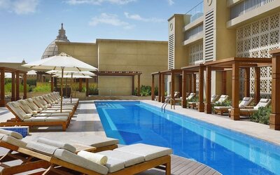 Pool lounge chairs at Hilton Dubai Al Habtoor City.