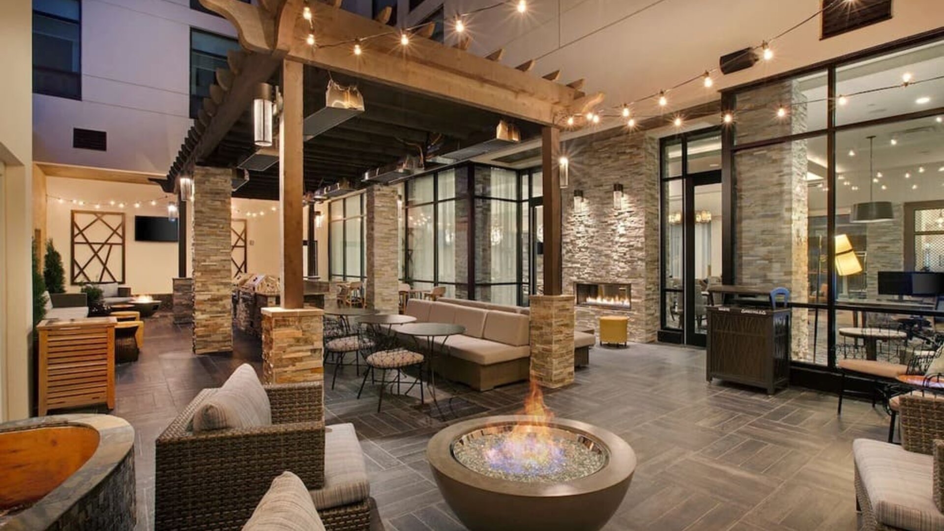 Coworking and lobby area with fire place at Homewood Suites By Hilton Louisville Downtown.