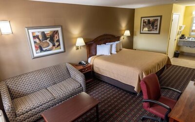 Spacious king room with work station at Loyalty Inn Hawkinsville.