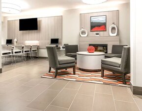 Lobby and coworking space at Coratel Inn & Suites By Jasper Rochester.