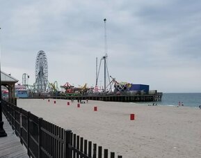 Beach arcade and promenade nearby at Bay Breeze Motel.