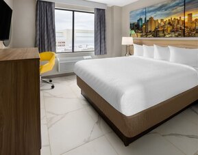 King room with natural light at Days Inn By Wyndham Staten Island.