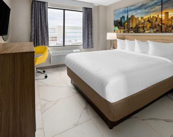 King room with natural light at Days Inn By Wyndham Staten Island.