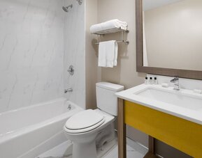 Guest bathroom at Days Inn By Wyndham Staten Island.