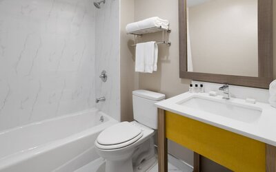 Guest bathroom at Days Inn By Wyndham Staten Island.