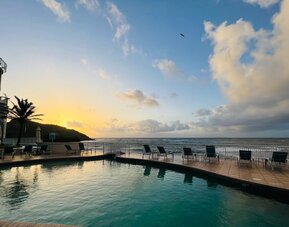 Sunset reflecting off the waters of the Infinity Pool at the Oyster Bay Resort in St. Maarten.