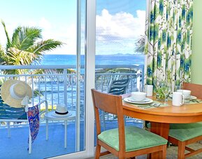Sunset on the patio near a work desk of a day room at Oyster Bay Resort in St. Maarten.