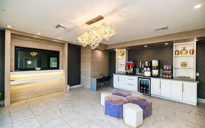 Lobby and lounge area at Palace Inn Blue IAH East.