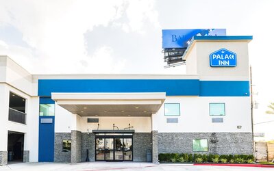Hotel exterior at Palace Inn Blue IAH East.