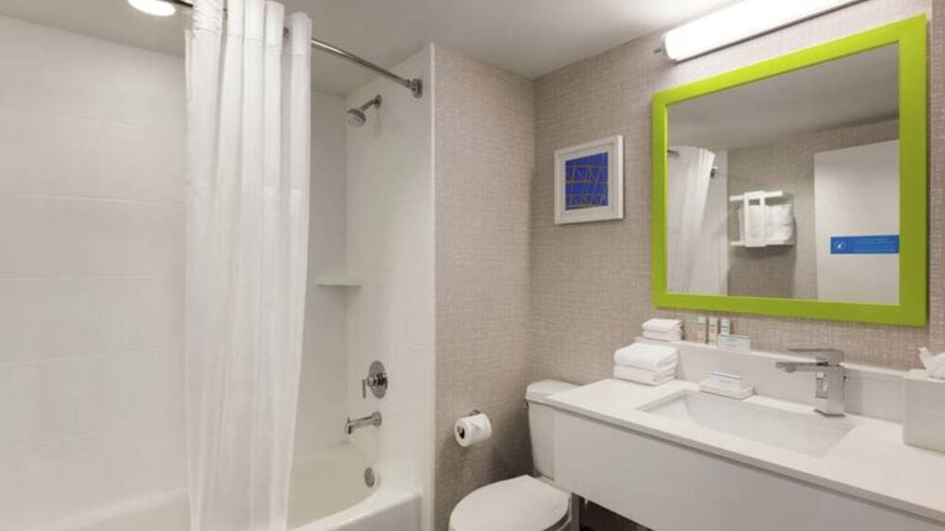 Guest bathroom with shower and tub at Hampton Inn & Suites Ft. Lauderdale Airport/South Cruise Port.