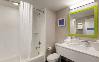 Guest bathroom with shower and tub at Hampton Inn & Suites Ft. Lauderdale Airport/South Cruise Port.