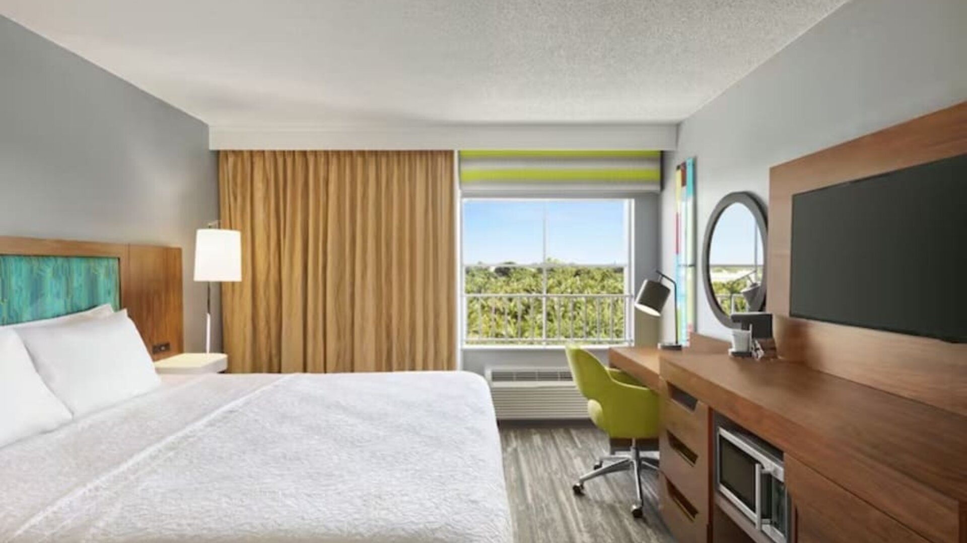 Day use room with work desk and natural light at Hampton Inn & Suites Ft. Lauderdale Airport/South Cruise Port.