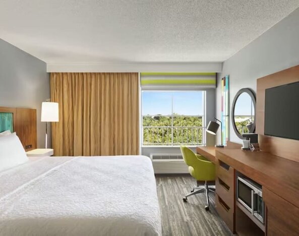 Day use room with work desk and natural light at Hampton Inn & Suites Ft. Lauderdale Airport/South Cruise Port.