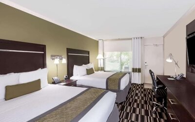 Two queen beds at Uptown Oasis San Jose Airport.