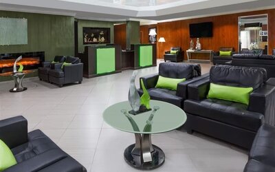 Lounge and coworking space at Uptown Oasis San Jose Airport.