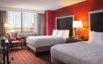 Two queen beds at Laguardia Plaza Hotel.