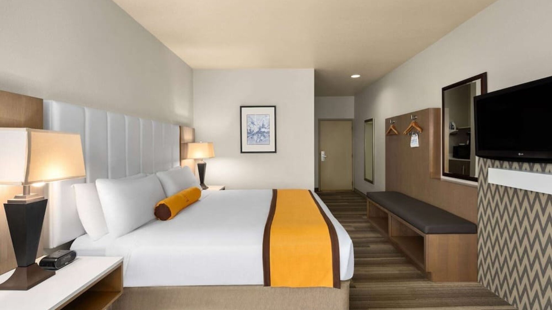 King bed with TV at Hotel Marguerite.