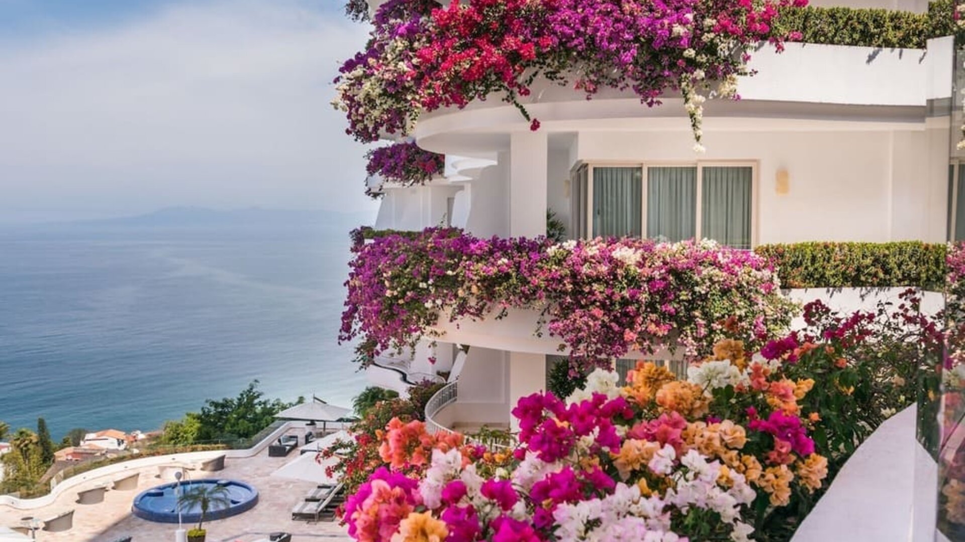 Luxury hotel with flowers at Grand Miramar All Luxury Suites & Residences.