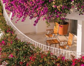 Day use room with outdoor seating at Grand Miramar All Luxury Suites & Residences.