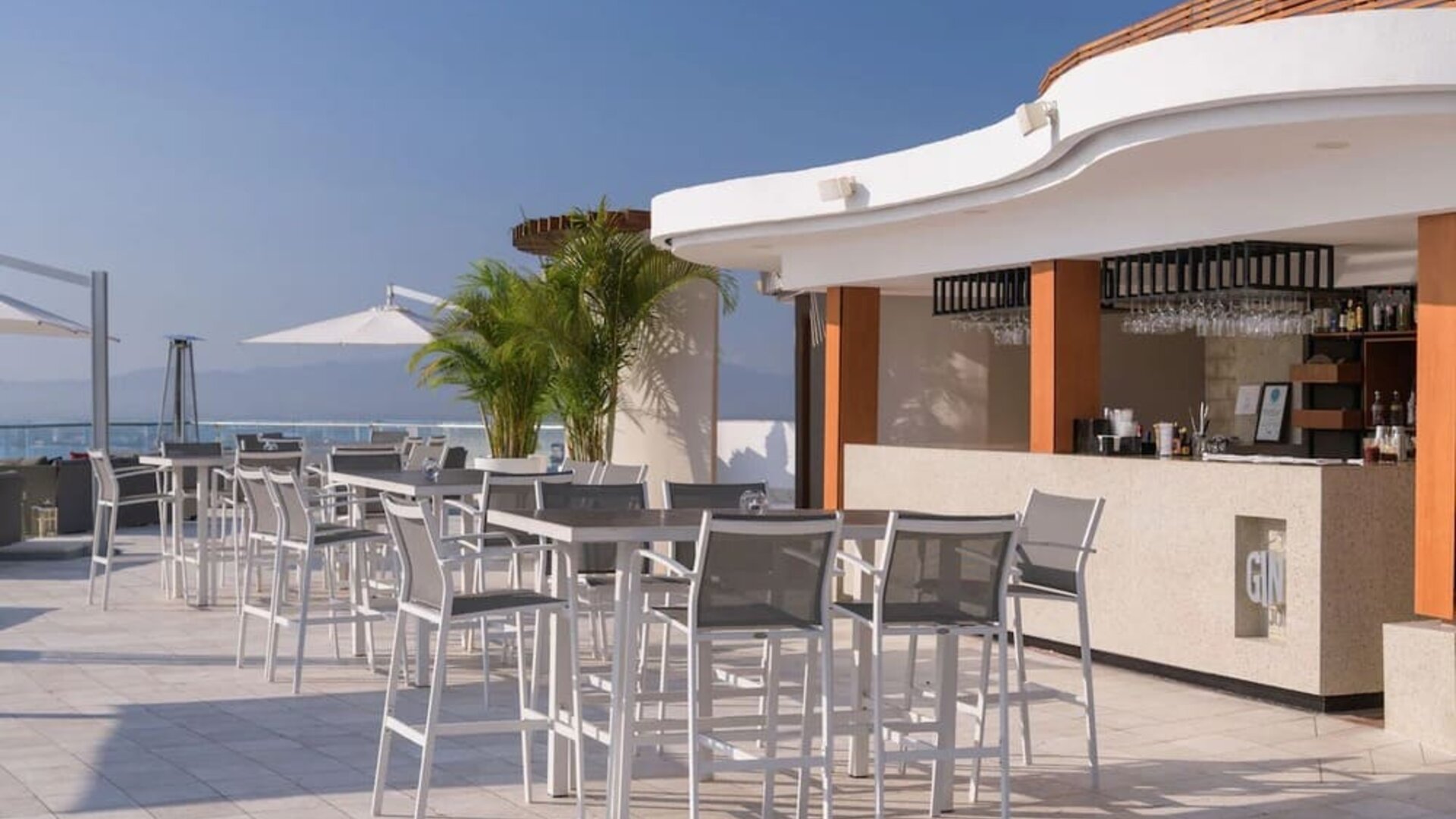 Hotel bar and terrace at Grand Miramar All Luxury Suites & Residences.