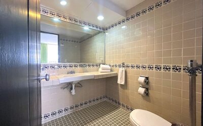 Day use room with guest bathroom at Hotel Delfin PV Beach Resort.