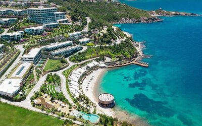 Hotel exterior and ocean view at Le Méridien Bodrum Beach Resort.