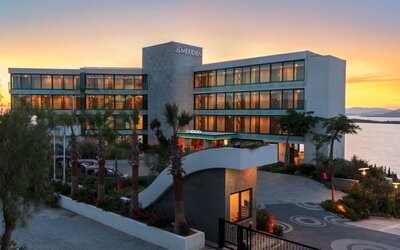 Hotel exterior at sunset at Le Méridien Bodrum Beach Resort.