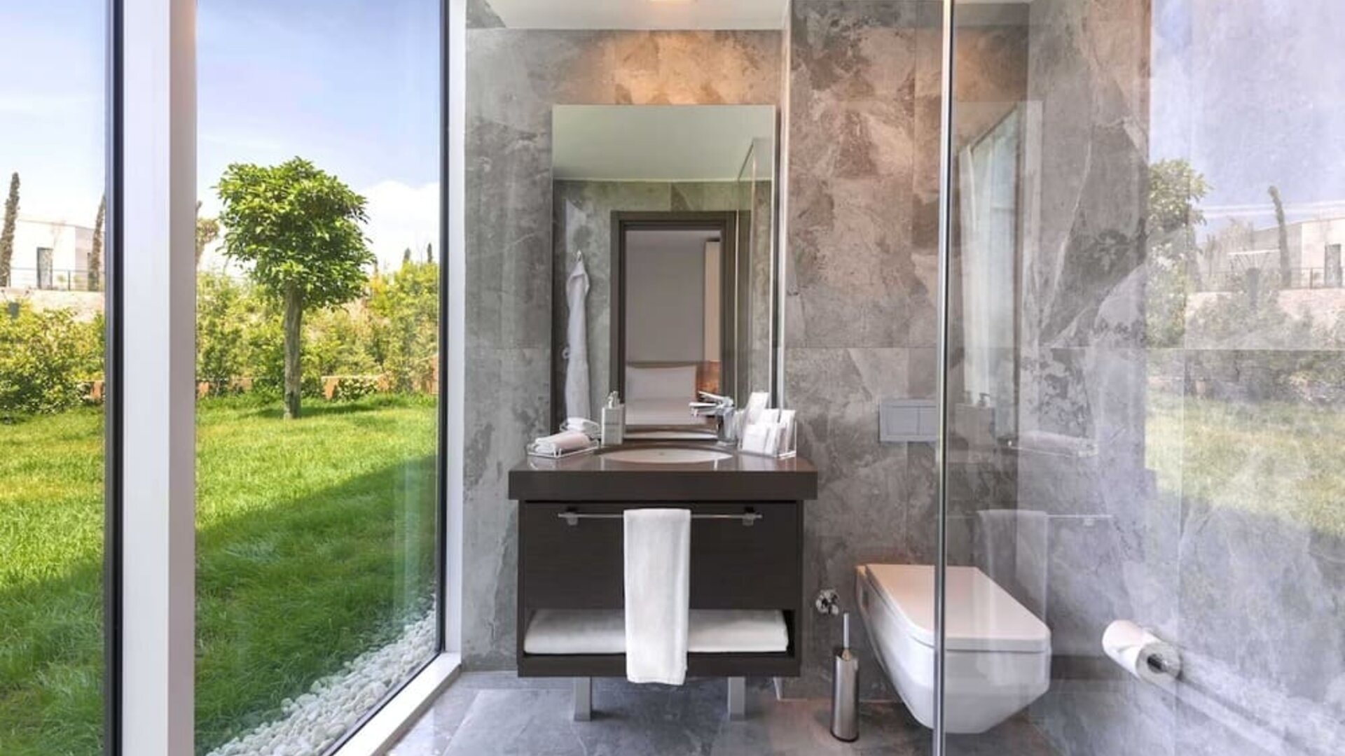 Guest bathroom with shower at Le Méridien Bodrum Beach Resort.