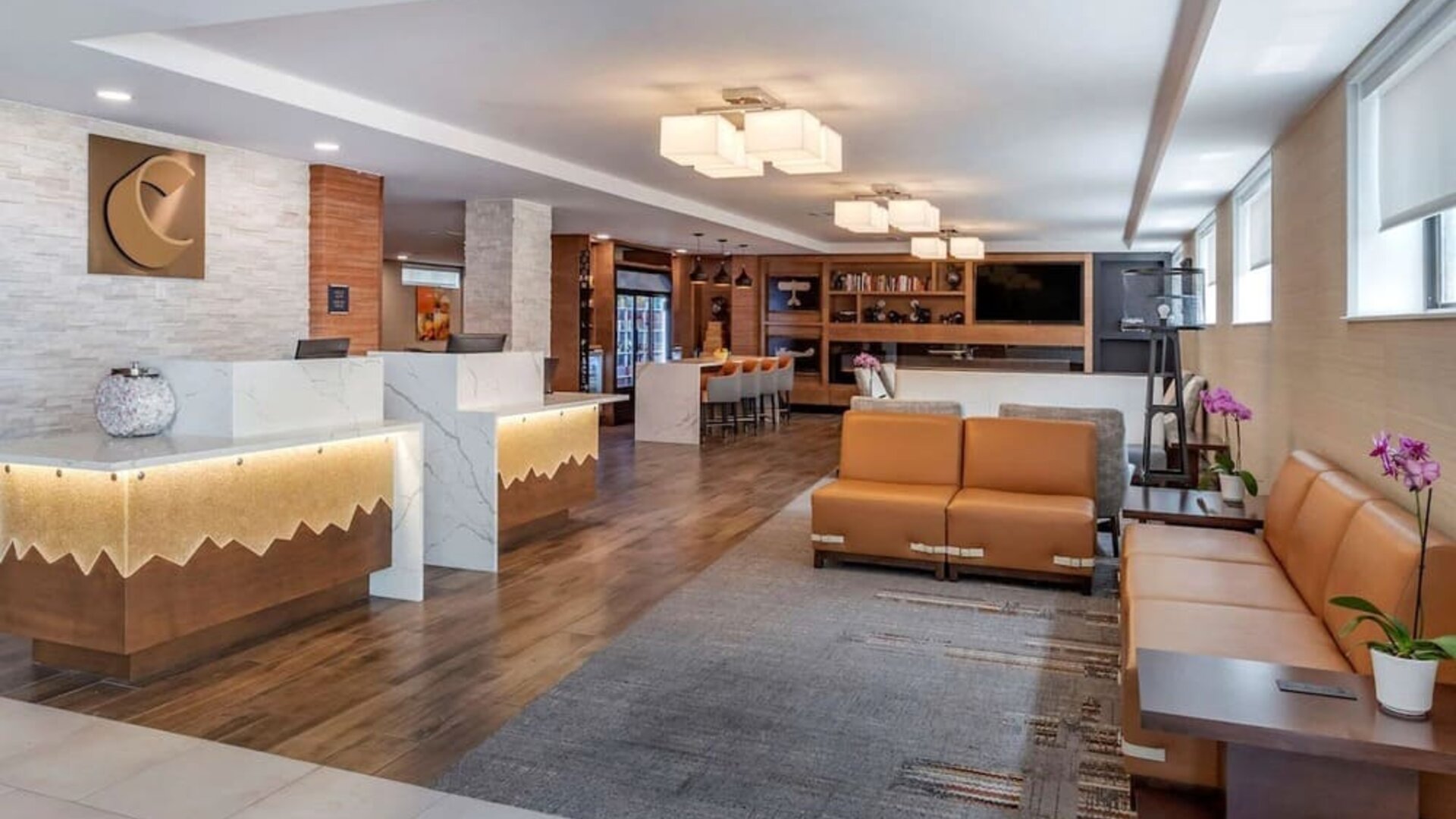 Lobby and coworking lounge at Comfort Inn JFK Airport.