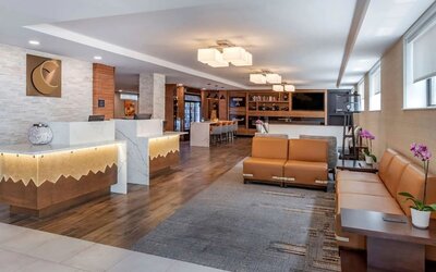 Lobby and coworking lounge at Comfort Inn JFK Airport.