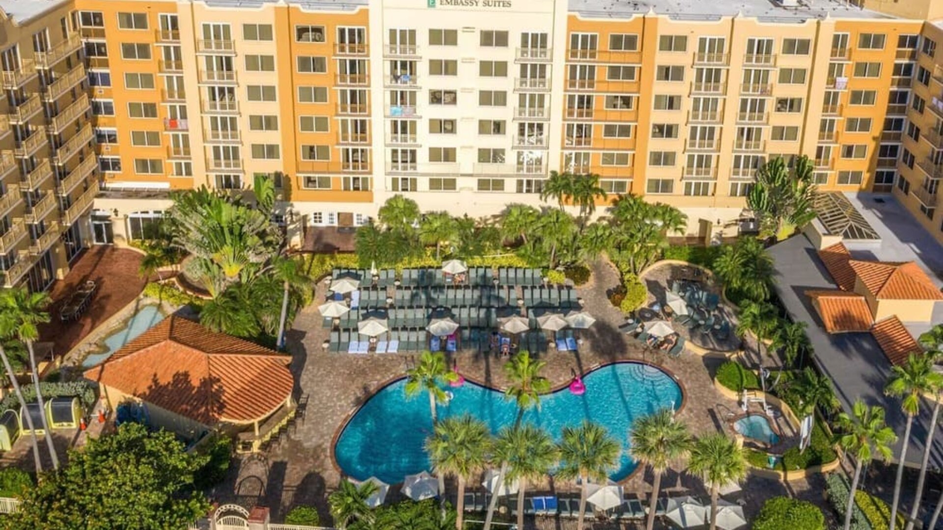 Hotel with large outdoor pool at Embassy Suites By Hilton Deerfield Beach Resort & Spa.