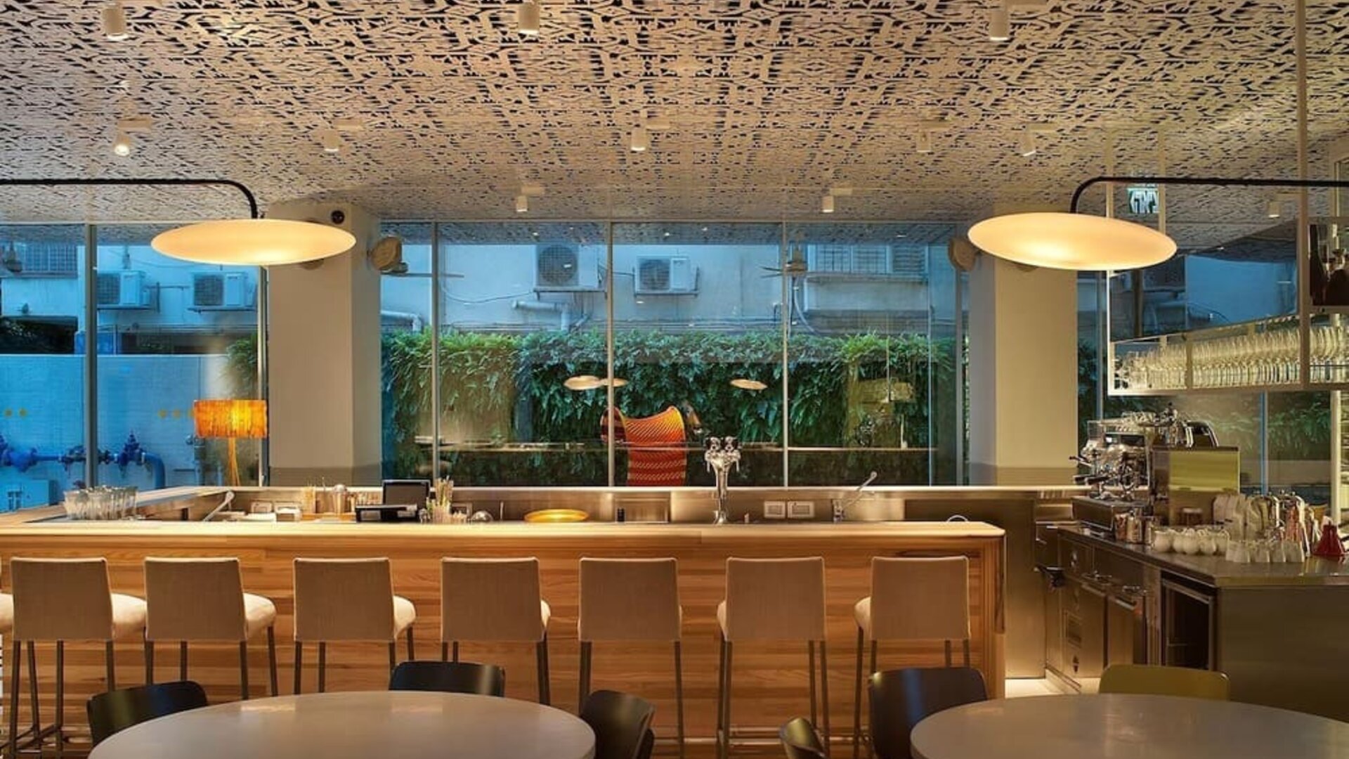 Hotel bar at night at Mendeli Street Hotel.