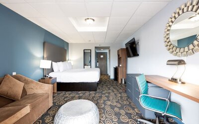 Spacious king room with lounge area at Regency Miami Airport By Sonesta.