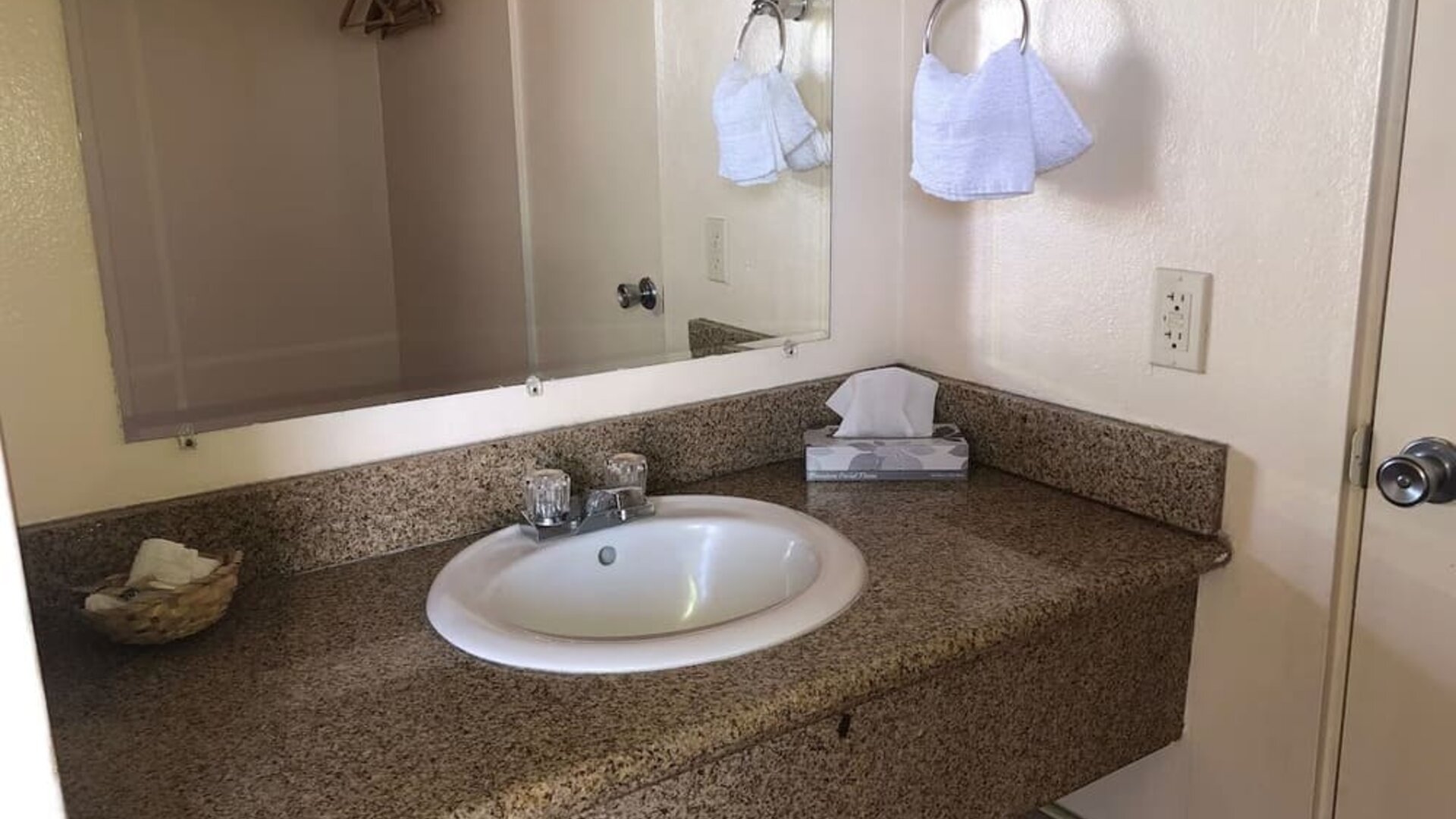 Guest bathroom with shower at Economy Inn, Fresno.