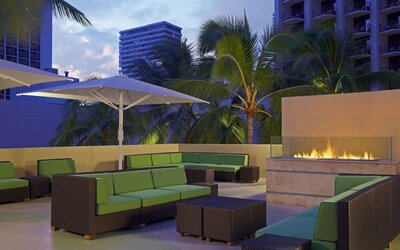 Rooftop terrace and fire pit at Hyatt Place Waikiki Beach.