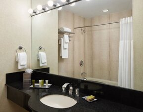 Guest bathroom with shower at M Social New York Downtown.