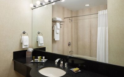 Guest bathroom with shower at M Social New York Downtown.