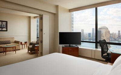 Comfortable day use room with TV and lounge at M Social New York Downtown.