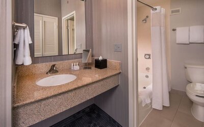 Guest bathroom with shower at Courtyard Dulles Airport Chantilly.