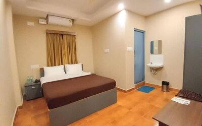 Day room with AC and fan at The Nisarga Residency.