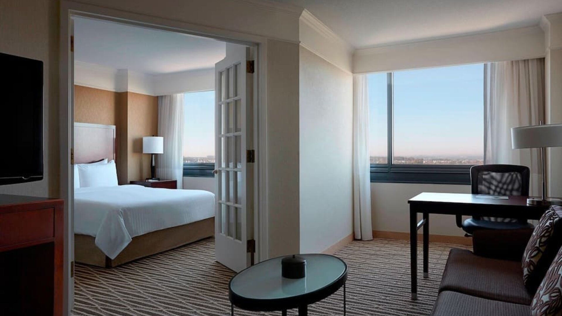 Spacious king suite with lounge area at Washington Dulles Marriott Suites.