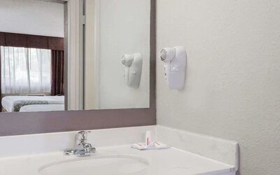 Day room with guest bathroom at Days Inn By Wyndham St Augustine/Historic Downtown.