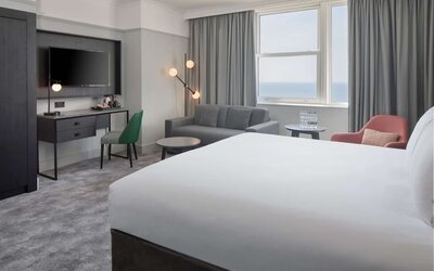 Day use room with work desk and lounge area at DoubleTree By Hilton Brighton Metropole.