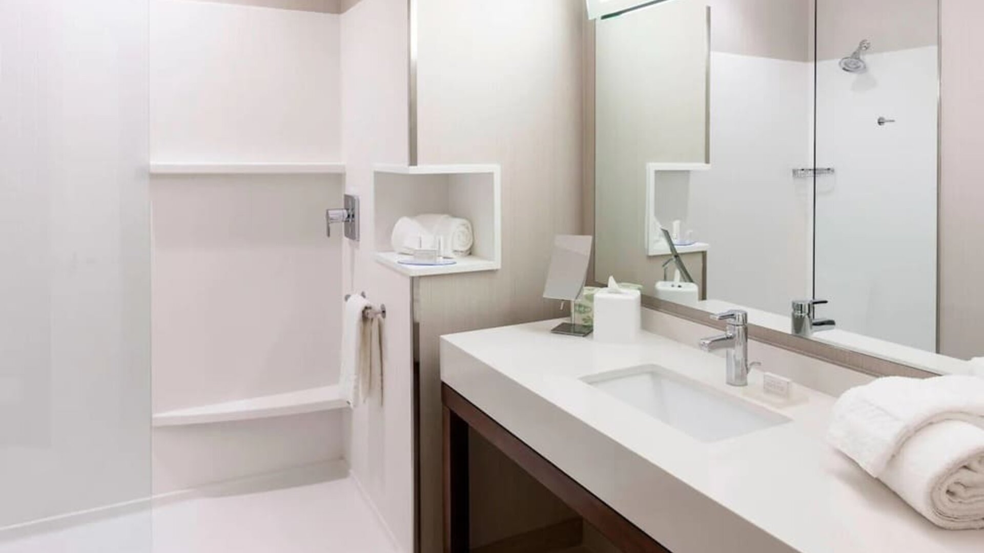 Guest bathroom with shower at Courtyard By Marriott Houston North/ Shenandoah.  