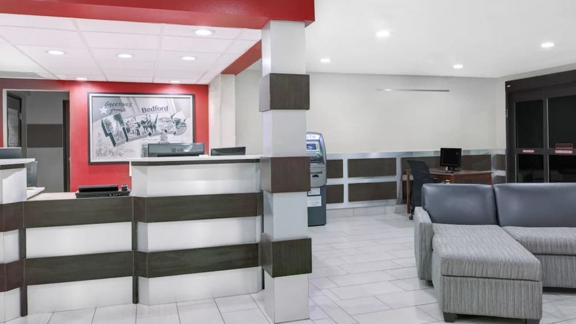 Lobby and coworking lounge at Super 8 Bedford DFW Airport West.  