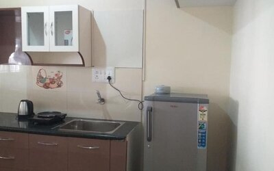 Day room with kitchen at The Nisarga Grand.