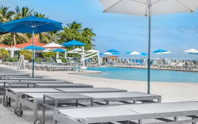 Sun loungers and umbrellas at Ramada Plaza Marco Polo Beach Resort.