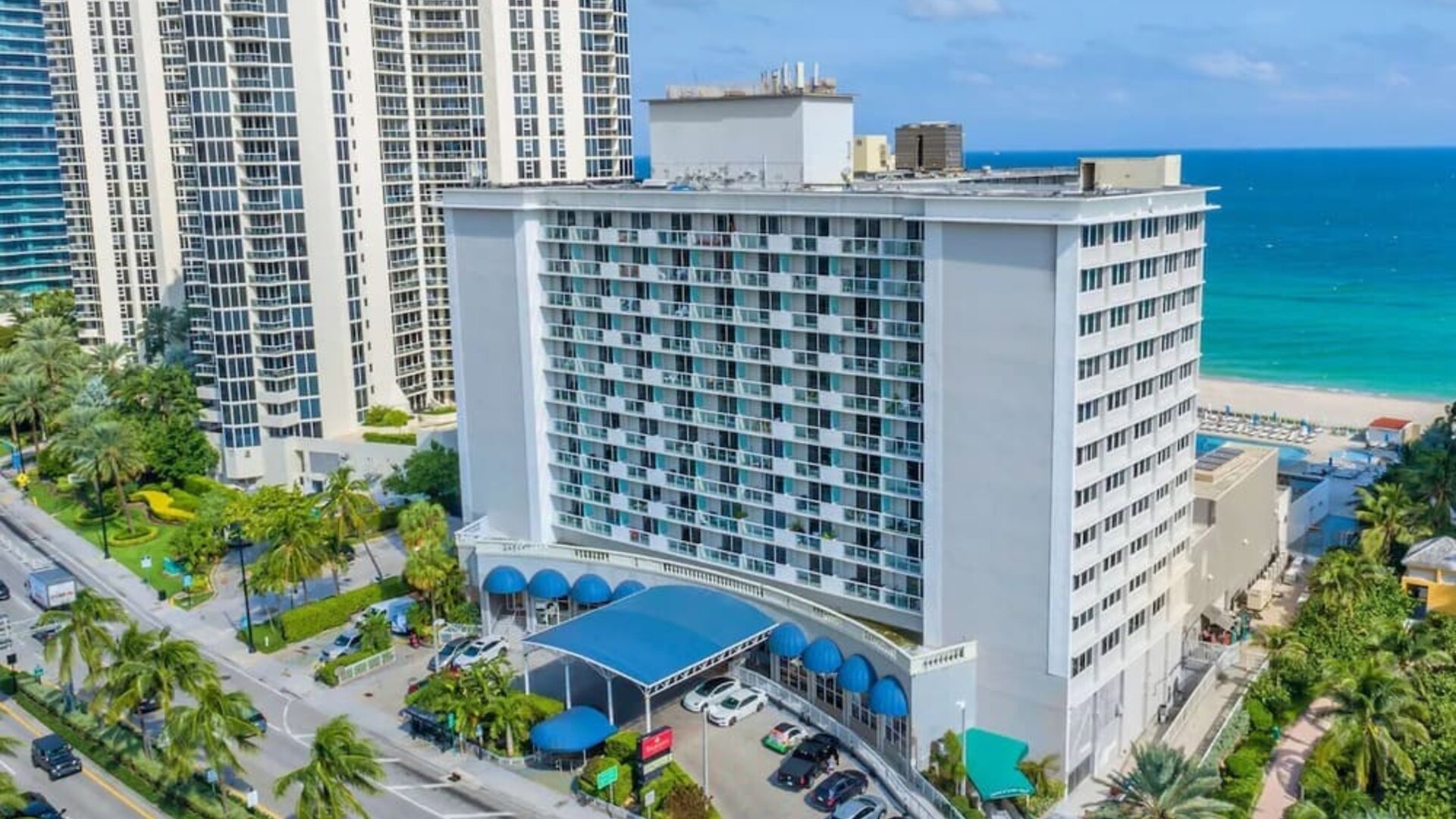 Hotel exterior and city view at Ramada Plaza Marco Polo Beach Resort.